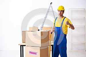 Young male professional mover doing home relocation
