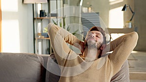 Young male relaxes on the sofa in a calm atmosphere alone