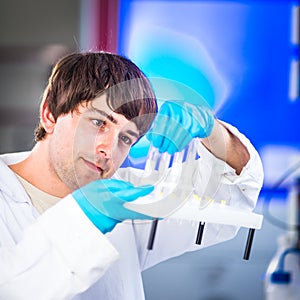 Young male researcher carrying out scientific research in a lab