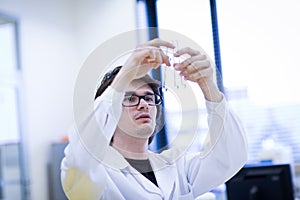 Young male researcher in a chemistry lab