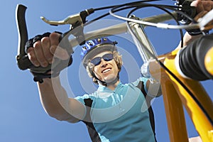 Young Male Riding Bicycle