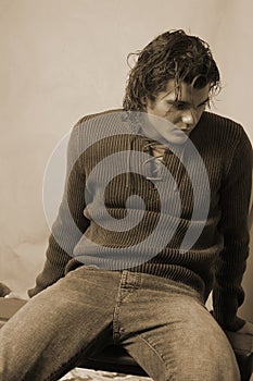 Young male in romantic sweater sepia