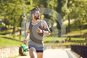 A young male runner jogs in the park