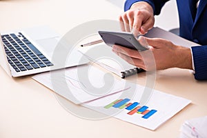 Young male sales analyst in growth concept