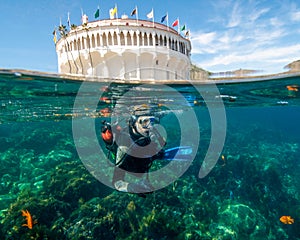 A Young Male Scuba Diver Begins a Dive at Casino Point in Catalina Island, California