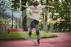Young male skateboard rider jumping and doing tricks