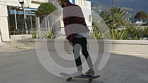 Young male skateboarder perform a few tricks