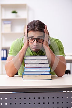 Young male student in the classroom