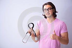 Young male student in front of board