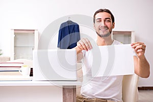 Young male student preparing for exams at home