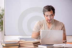 Young male student in tele-education concept