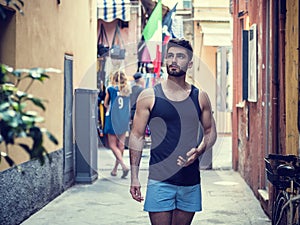 Young male tourist exploring old italian town