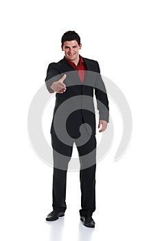 Young male wearing suit stretching hand for handshake