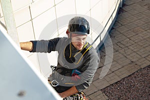 Young male worker admires the view of the city