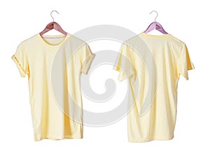 Young male in yellow t-shirt Roll up sleeves template tranparent background tee wooden hanger on empty background for man design