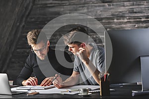 Young males doing paperwork