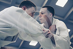 Young males practicing judo together.