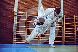 Young males practicing judo together.