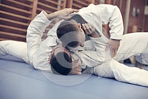 Young males practicing judo together.