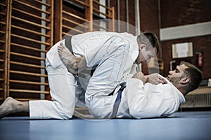 Young males practicing judo together.