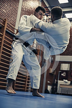 Young males practicing judo together.