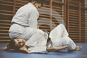 Young males practicing judo together.