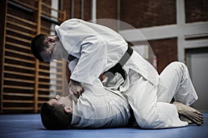 Young males practicing judo together.