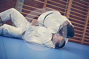 Young males practicing judo together.