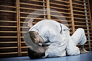 Young males practicing judo together.