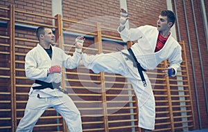 Young males practicing judo together.