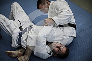 Young males practicing judo together.
