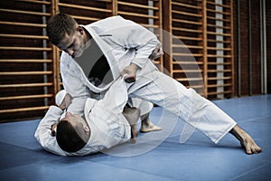 Young males practicing judo together.