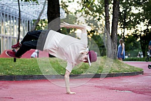 Young man acrobat freedom physical activity in urban city concept