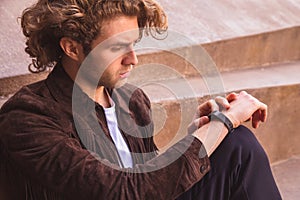 Young man with activity tracker. Smart sport device