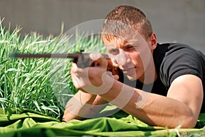 Young man aiming