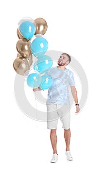 Young man with air balloons