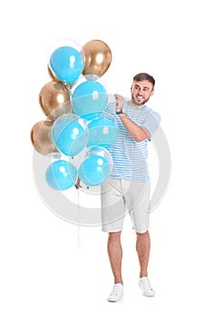 Young man with air balloons
