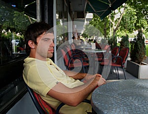 Young Man Alone In The Caffe