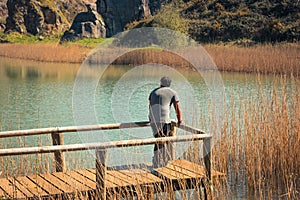 A young man alone on a lake, portrait, la arboleda, basque country