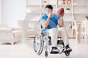 The young man american football player recovering on wheelchair