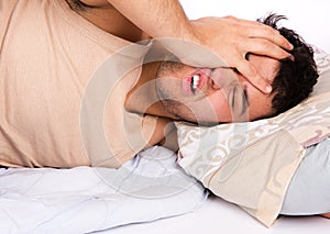 Young man annoyed by the noise