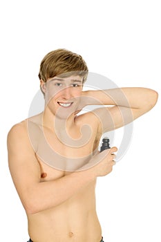 Young man applying deodorant