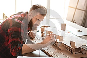 Young man architect working in the office ocuupation