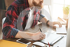 Young man architect working in the office ocuupation