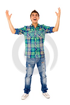 Young man with arms raised