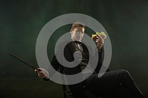 Young man in art action isolated on dark green background. Retro style, comparison of eras concept.