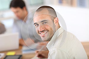 Young man attending business class