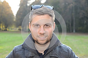 Young man in autumn park