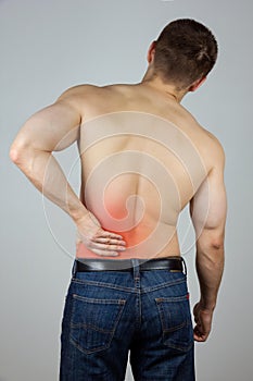 Young man with back pain