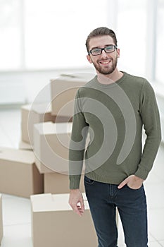 Young man, on the background of the new apartments